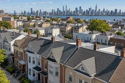 Illustrative residential rooftop scene, not a verified photograph of the named city